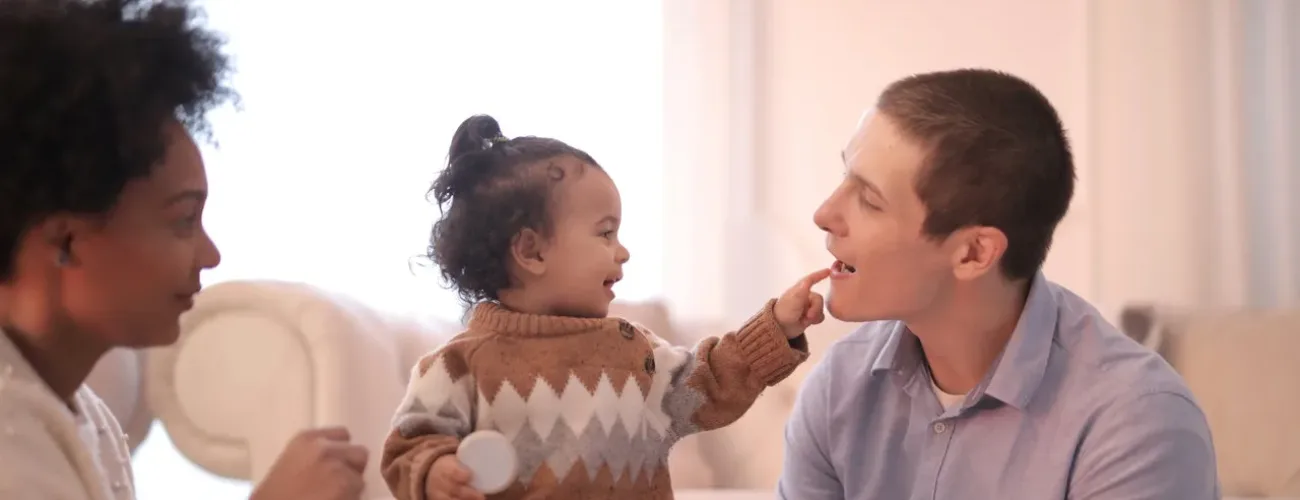 Mother, father and child displaying example of a healthy co-parenting relationship